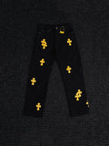 Chrome Hearts Yellow Cross Patch Black Jeans — hero