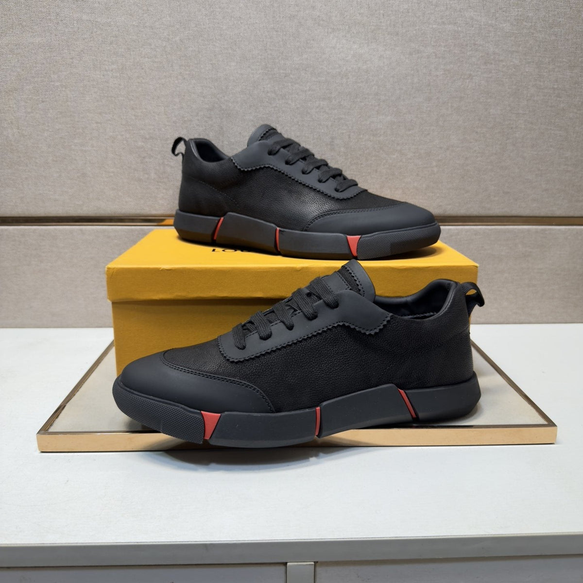 Louis Vuitton Black Low-Top Sneakers with Red Accents — front