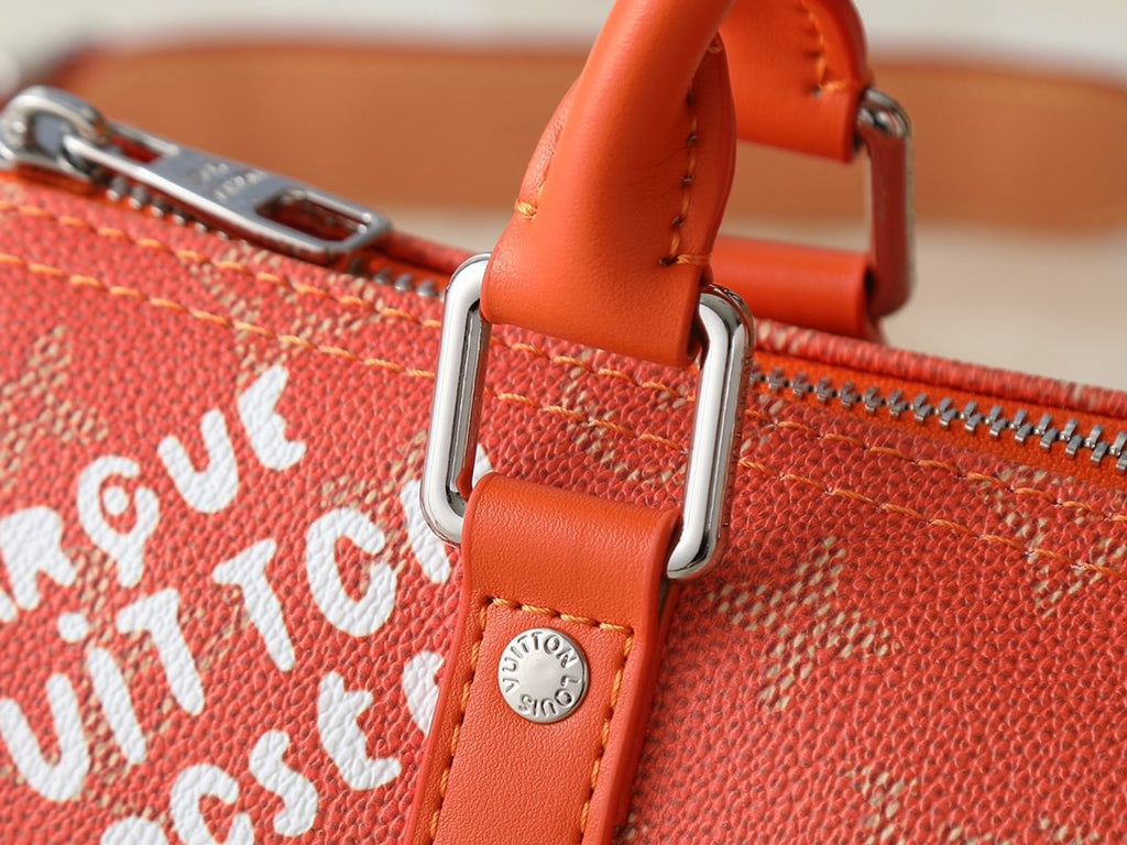 Louis Vuitton Keepall Orange Monogram Barrel Bag — detail