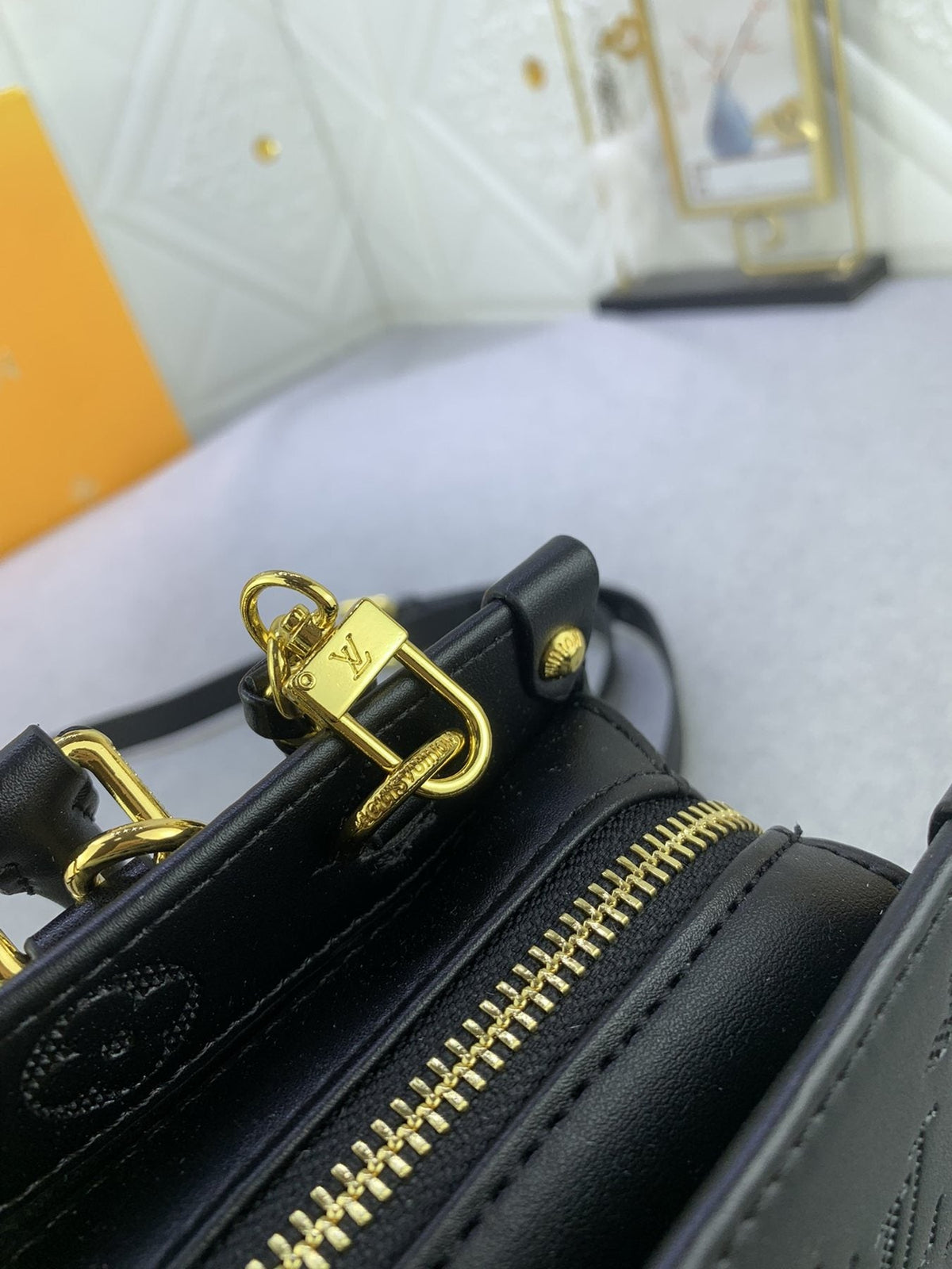 Louis Vuitton OnTheGo East West Embossed Leather Handbag — detail