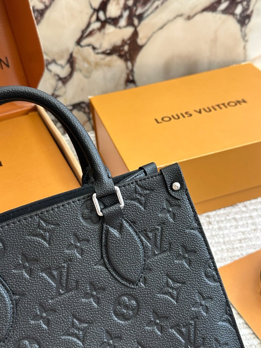 Louis Vuitton Onthego Black Embossed Tote — detail