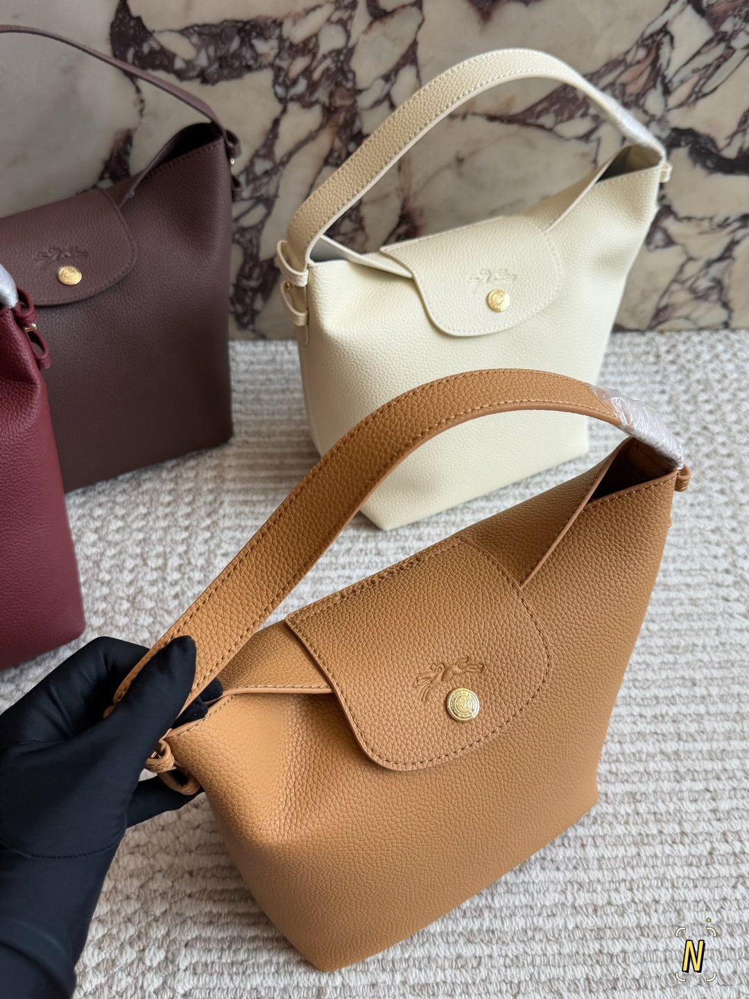 Longchamp Pebbled Bucket Bag with Rounded Snap Flap — front