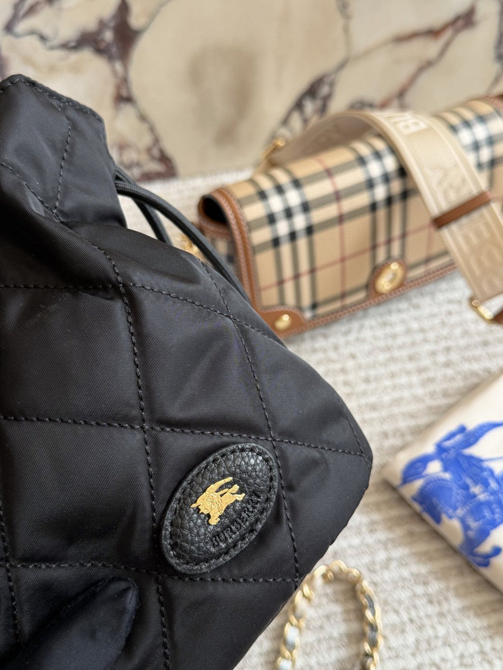 Black Quilted Chain-Strap Bucket Bag — detail