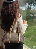 Louis Vuitton Squire East West Monogram Shoulder Bag — model