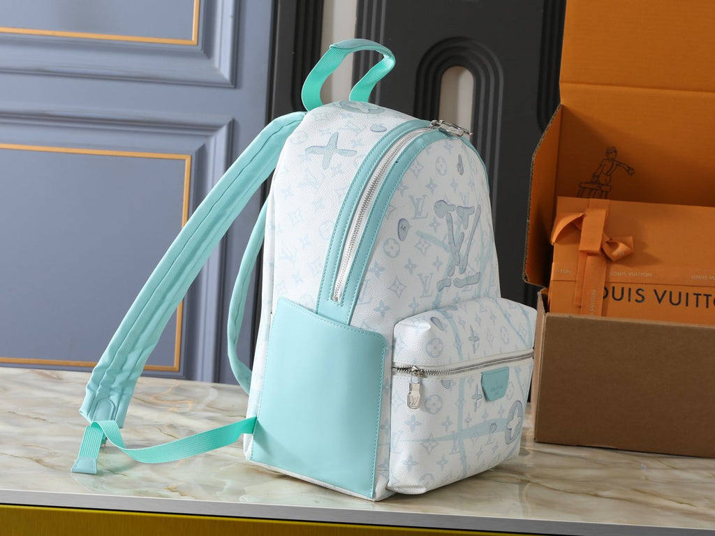 Louis Vuitton Discovery Monogram Backpack — side