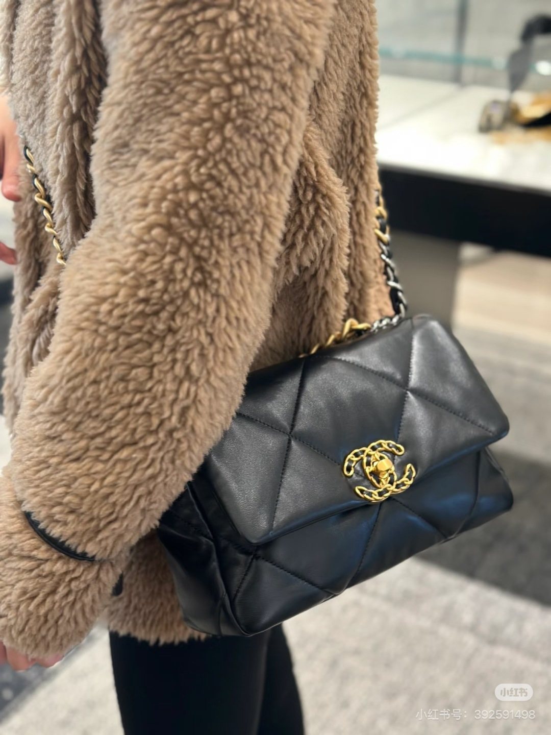 Chanel 19 Diamond-Quilted Flap Shoulder Bag — model