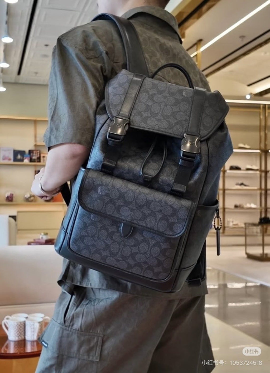 Coach Twin-Buckle Drawstring Backpack — model