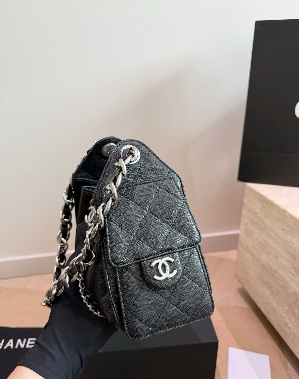 Chanel 25 Quilted Drawstring Bucket Bag — side