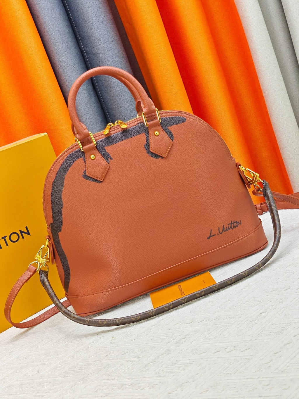 Louis Vuitton Alma Soft Cognac Top-Handle Bag — hero