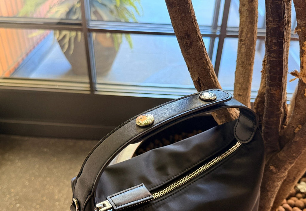 Prada Rounded Top Handle Shoulder Bag — detail